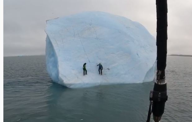 Adventure Magazine - Iceberg flips with Ice Climbers on it